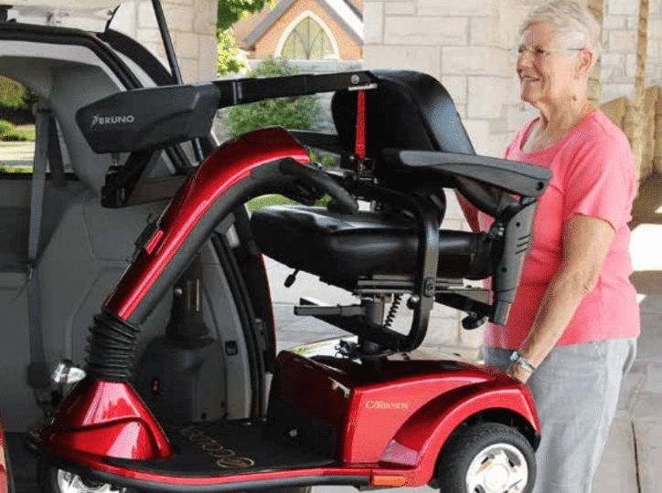 Unique Auto Service - Assisted Mobility Woman on Mobility Equipment
